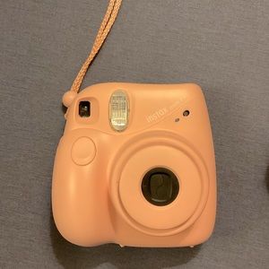 Fuji pink instax mini camera with purple case